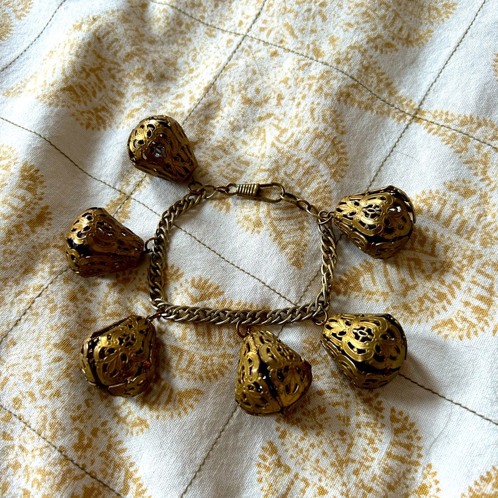 Vintage gold-tone chain bracelet with filagree bell-filled dangling baubles